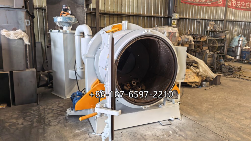 rotary drum shot blasting machine is a batch-type surface treatment system. Metal workpieces are loaded into a rotating drum or barrel, where controlled tumbling exposes different surfaces to high-speed abrasive particles thrown by a centrifugal blast wheel.